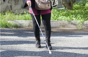 blind-girl-walking-with-cane